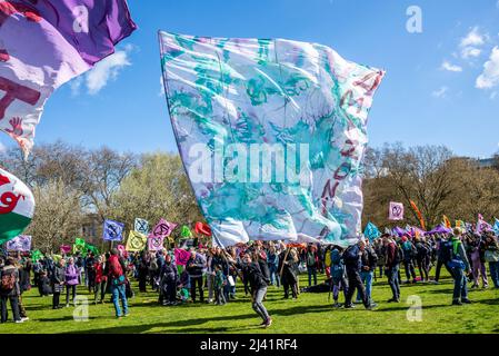 Extinction Rebellion protesters launching a period of civil disruption in London from the 9 April 2022. Huge Amazonia flag and crowds in Hyde Park Stock Photo