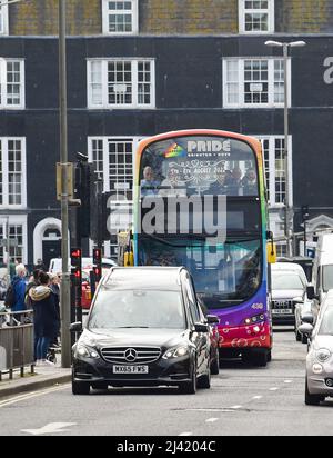 Brighton UK 11th April 2022 - The funeral procession for well known gay rights campaigner George Montague heads through Brighton today . George who was affectionately known as 'The Oldest Gay in the Village' died recently at the age of 98  : Credit Simon Dack / Alamy Live News Stock Photo