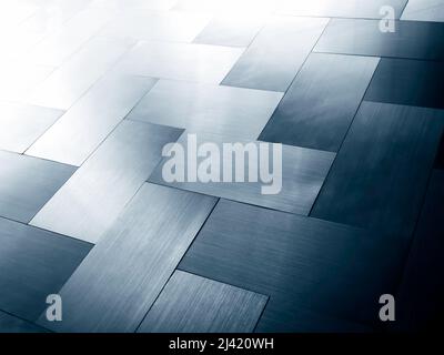 Modern shiny silver and blue metal sheet plates panel, grid pattern floor background, perspective view. Stock Photo