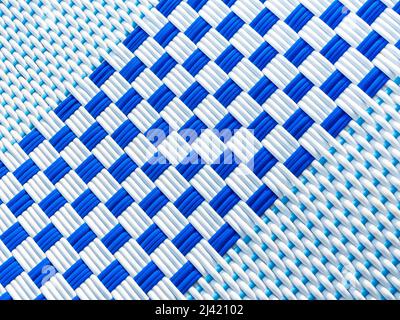 Abstract white and blue rattan pattern background. Close-up checkered pattern caused by the interweaving of white and blue lines, top view. Stock Photo