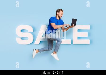 Full length body size view collage image of motivated worker guy jumping rushing huge sale carrying laptop isolated colorful background Stock Photo