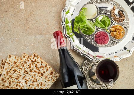 Passover Seder plate with traditional food ontravertine stone background Stock Photo