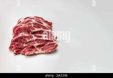 Fresh pork steaks. front view. Slices pork loin on gray background. raw pork marbled steaks. Raw meat. fresh raw beef lamb. cooking pork meat on white Stock Photo