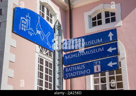Tourist sign in front of the historic pink church in Gifhorn, Germany Stock Photo