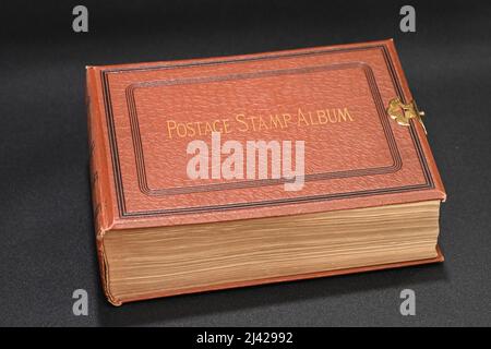 An original Postage Stamp Album filled with stamps collected over the past century. Stock Photo