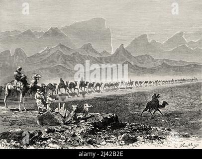 Mirage effect in the desert. Caravan of pilgrims on camels on their way to Nedjed, Saudi Arabia. Pilgrimage to Nedjed, cradle of the Arab race by Lady Anna Blunt 1878-1879, Le Tour du Monde 1882 Stock Photo