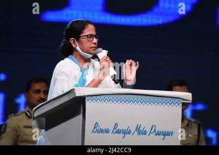 Kolkata, West Bengal, India. 11th Apr, 2022. Mamata Banerjee, Chief Minister of West Bengal, delivering her inaugural speech after inauguration by herself of the Biswa Bangla Mela Prangan, formerly Milan Mela, the permanent fairground after a complete overhaul of infrastructure. The revamped mela ground which is spread across 25 acres and at a cost of Rs 352 crore. The ground, expected to accommodate more than 5,000 people, has two large air-conditioned pavilions, each 120m by 75m in size. The facilities have come up on 31,894 sq m. It has a state-of-the-art convention hall, a multi-storey pa Stock Photo