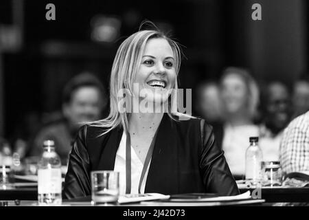 Johannesburg, South Africa - August 20, 2015: Delegates attending a sales convention in large conference hall Stock Photo