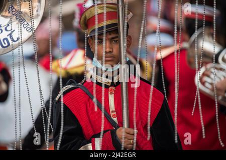 Kathmandu, Nepal- March 20,2022 : The wedding procession passes through the streets of the Patan Durbar Square with brass music. Stock Photo