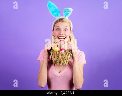 Happy easter woman with basket eggs. Bunny girl in rabbit ears. Spring holidays. Sale. Discount. Stock Photo