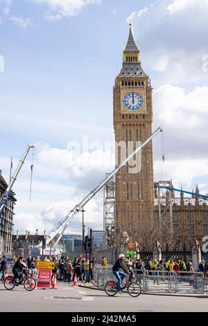 Cranes removing last of scaffolding from restored Elizabeth Tower