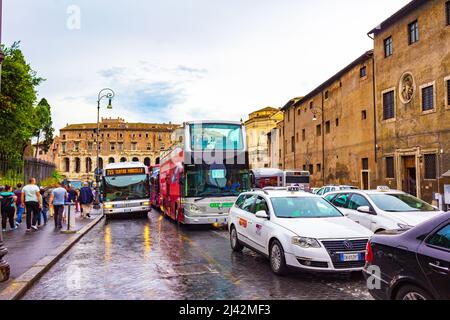 Busy street in the historical centre of Rome city on a rainy summer day, Via del Teatro di Marcello,Italy,June 2016 Stock Photo
