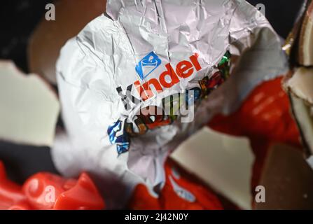 Kinder Surprise , also known as Kinder Egg or Kinder Surprise Egg, is a milk chocolate consisting of a chocolate egg surrounding a yellow plastic capsule with a small toy inside. Stock Photo