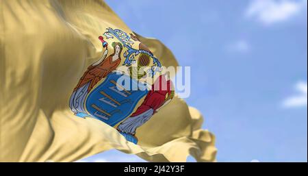 The US state flag of New Jersey waving in the wind. New Jersey is a state in the Mid-Atlantic and Northeastern regions of the United States. Democracy Stock Photo