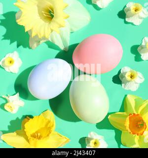 Pastel Easter egg flat lay with flowers Stock Photo