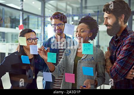 Its all about strategic planning. Cropped shot of coworkers brainstorming in a modern office. Stock Photo