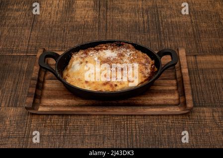 Instead of thick layers of ricotta and mozzarella cheese, lasagna bolognese features delicate layers of fresh pasta, spinach is traditional, yet simpl Stock Photo