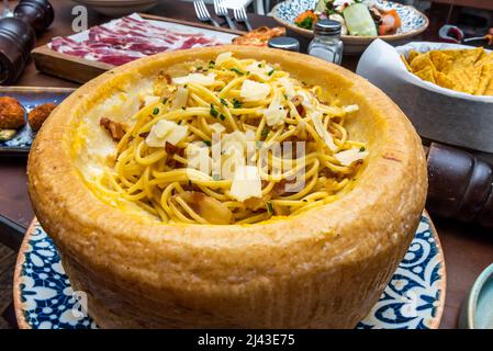 Macaroni and cheese is a casserole, what are the main ingredients are macaroni and cheese sauce. Cheddar cheese is traditionally used, although other Stock Photo