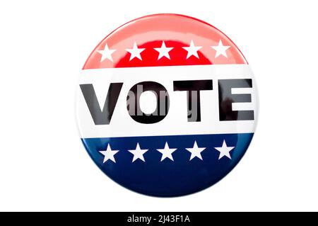 Democracy, presidential election and voting poll concept with red, white and blue vote glossy button pin with stars and stripes isolated on white back Stock Photo