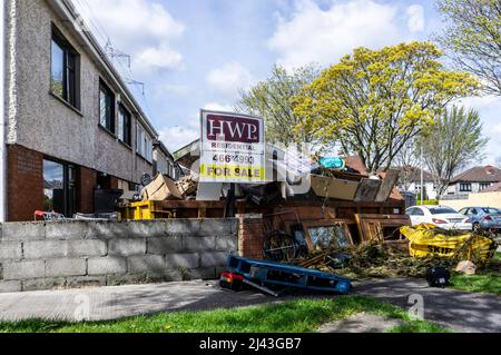 House Refurbishment. The contents of a house in a rubbish skip following a total house refurbishment. Stock Photo
