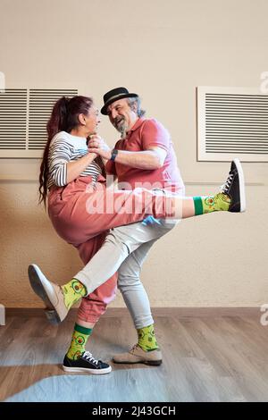 A man and a woman dancing Lindy Hop in a dance studio Stock Photo