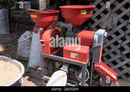 Mini electric rice milling machine Stock Photo