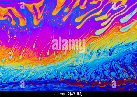 Rainbow colors. Psychedelic multi colored patterns background. Photo macro shot of soap bubbles Stock Photo