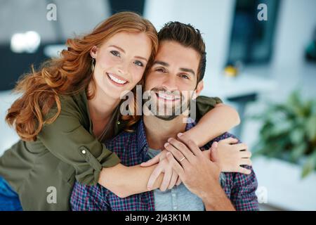 Looks like Ive found my perfect match. Portrait of an affectionate young couple embracing each other. Stock Photo