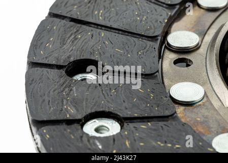 Used car clutch macro shots for friction linings, isolated on a white background. Stock Photo