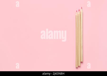 flat lay with pink school supplies and backpack isolated on pink