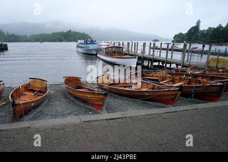 Rowing Boats At The Waters Edge In Bowness On Windermere Lake Windermere In The Lake District Cumbria England UK Stock Photo