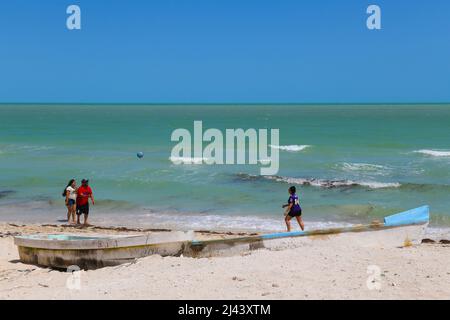 Locals playing with a balloon, Beach town of Chuburna, Yucatan Peninsula , Mexico Stock Photo