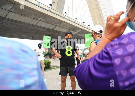 Bangkok, Thailand. 08th Apr, 2022. Bangkok gubernatorial candidate Chatchart Sitthiphan, number 8, campaigned at the Rama VIII Bridge on the Thonburi side, He has the nickname that the people have given him. The strongest man in the world. which will have an election on May 22, 2022, after the previous governor was appointed by the military junta following The last election was 9 years ago in 2013 for 9 years. (Photo by Adirach Toumlamoon/Pacific Press) Credit: Pacific Press Media Production Corp./Alamy Live News Stock Photo