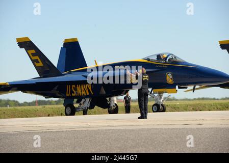 Members of the U.S. Navy Blue Angels perform pre-flight procedures prior to an aerial demonstration at the Titans of Flight Air Expo, Joint Base Charleston, South Carolina, April 10, 2022. The airshow showcases more than 50 aerial demonstration performances and static aircraft displays. (U.S. Air Force Photo by 2d Lt. Victor A. Reyes) Stock Photo