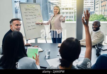 Thats an excellent idea. Shot of a mature businesswoman giving a training presentation. Stock Photo