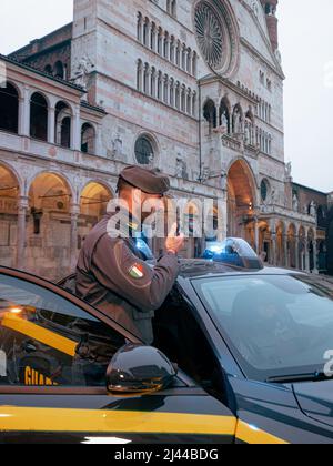 IRs Guardia di Finanza tax police force officer and patrol in Piazza Duomo, Cremona, Italy Stock Photo