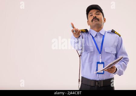 Portrait of Security guard objecting to something Stock Photo