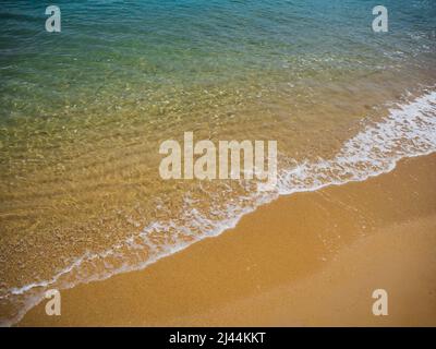 Soft ocean wave on a beautiful sandy beach Stock Photo