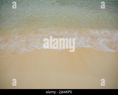 Soft ocean wave on a beautiful sandy beach Stock Photo