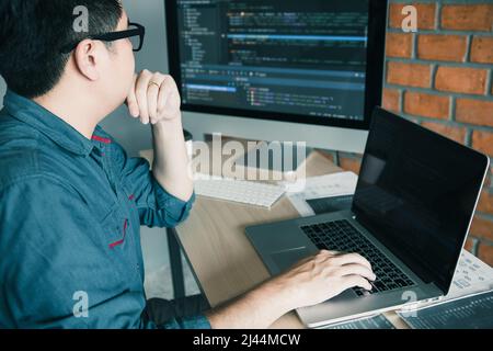 Developing programming and coding technology working in a software develop company office. Stock Photo