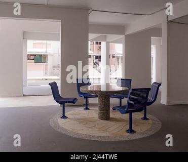 Sitting and recreational area under a HDB void deck in a housing estate in Singapore. Stock Photo