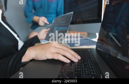 Asian man working code program developer computer web development working design software on desk in office. Stock Photo