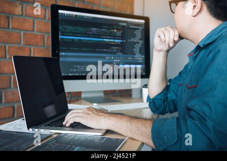 Developing programming and coding technology working in a software develop company office. Stock Photo