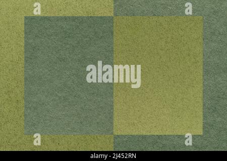 Texture of craft dark green and olive paper background, half two colors, macro. Structure of vintage dense craft cardboard. Felt backdrop closeup. Stock Photo