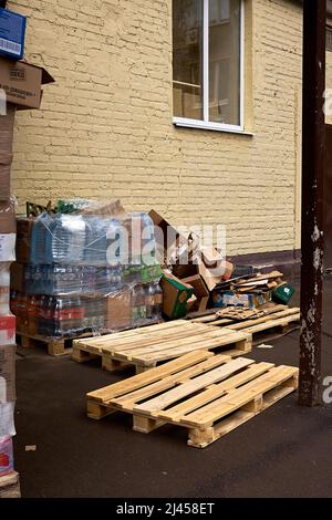 Moscow, Russia - April 10, 2022: Pile of cardboard boxes appears after unloading goods to store. A lot of packaging is used for transportation, it Stock Photo