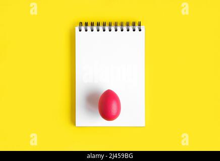Creative Easter notepad mock up on yellow background. Decorated Easter ...