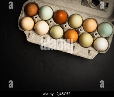 Fresh multicolored raw eggs Stock Photo