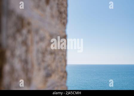 stone wall on the background of the sea close-up. Mediterranean sea landscape Stock Photo