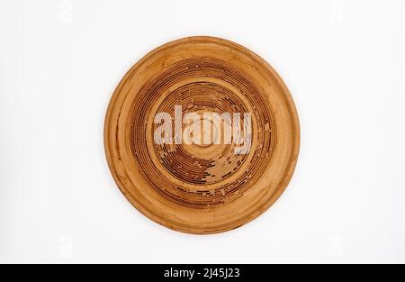 Brown clay plate isolated on white, top view. High quality photo Stock Photo