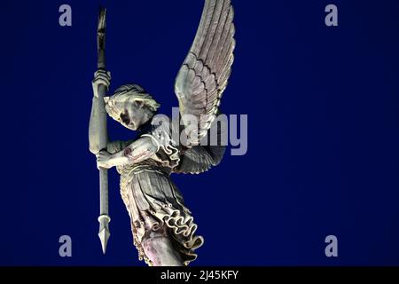 Statue of Archangel Michael slaying a dragon at the Mont Saint-Michel ...